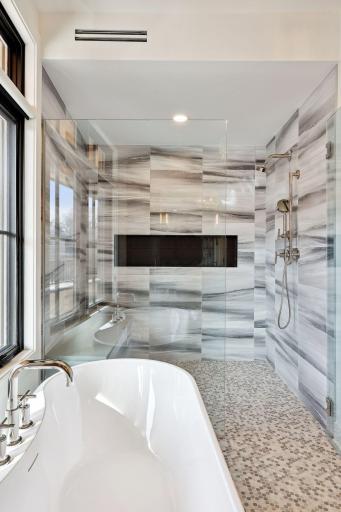 Soak the stress of the day away in the large tub or the spacious shower with dual shower heads