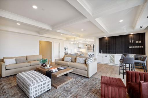 A stunning wet bar anchors the other end of the living room