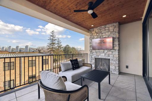 Covered deck with gas fireplace and stone surround