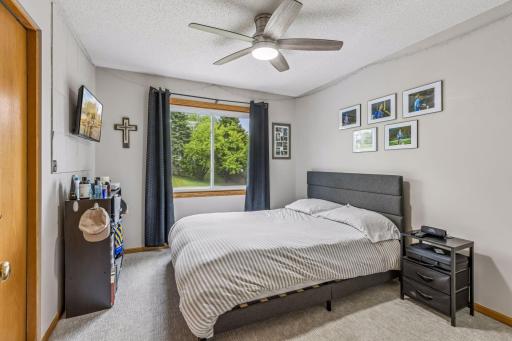 Comfortable secondary bedroom with new carpet and plenty of natural light.