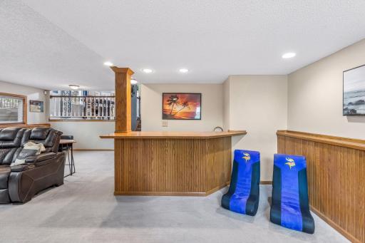 Convenient wet bar with sink and cabinetry