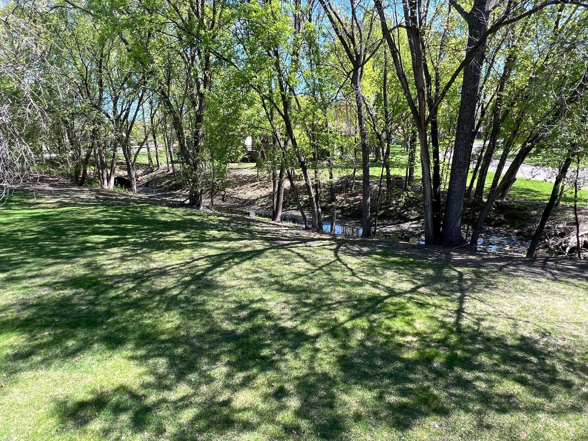 This home overlooks a wooded area and small creek.