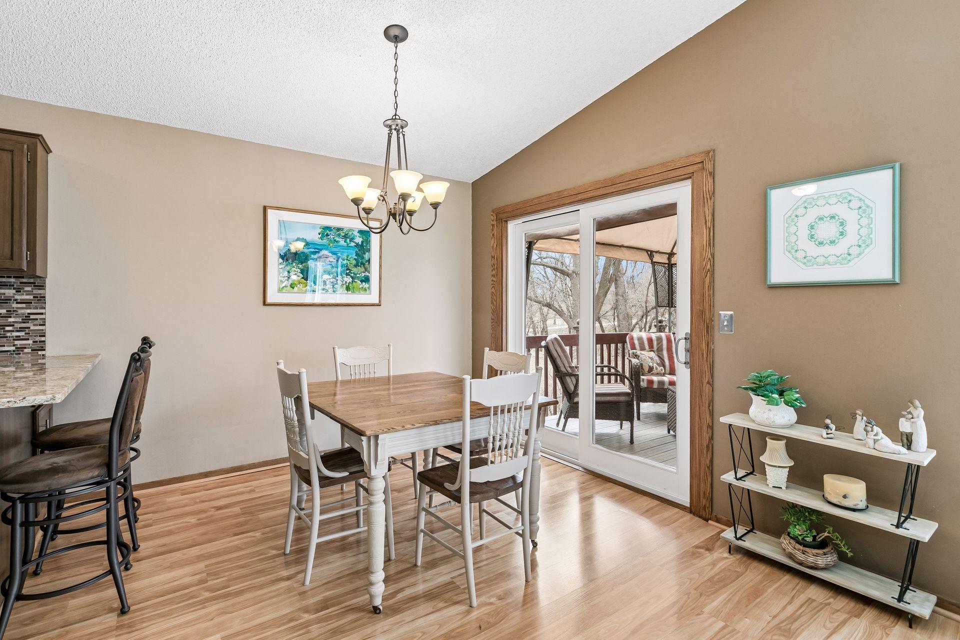 Informal dining area with abundant natural light and a seamless walkout to the spacious deck & private backyard. Perfect for everyday living and easy outdoor entertaining.