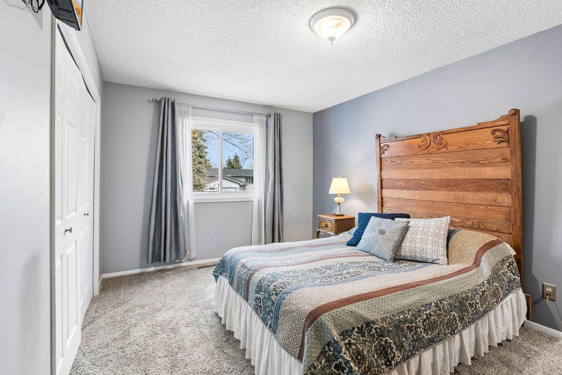 The primary bedroom is comfortable and bright with ample closet space.