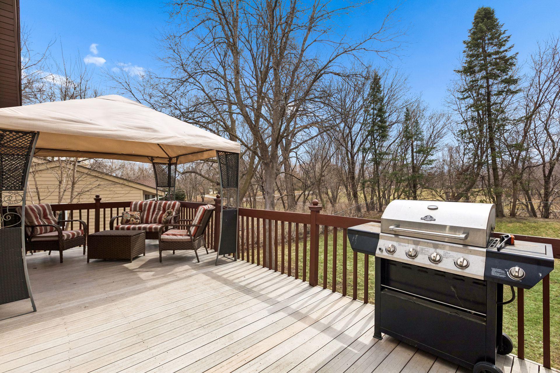 Incredible deck that's south facing that overlooks private backyard, park & trails.