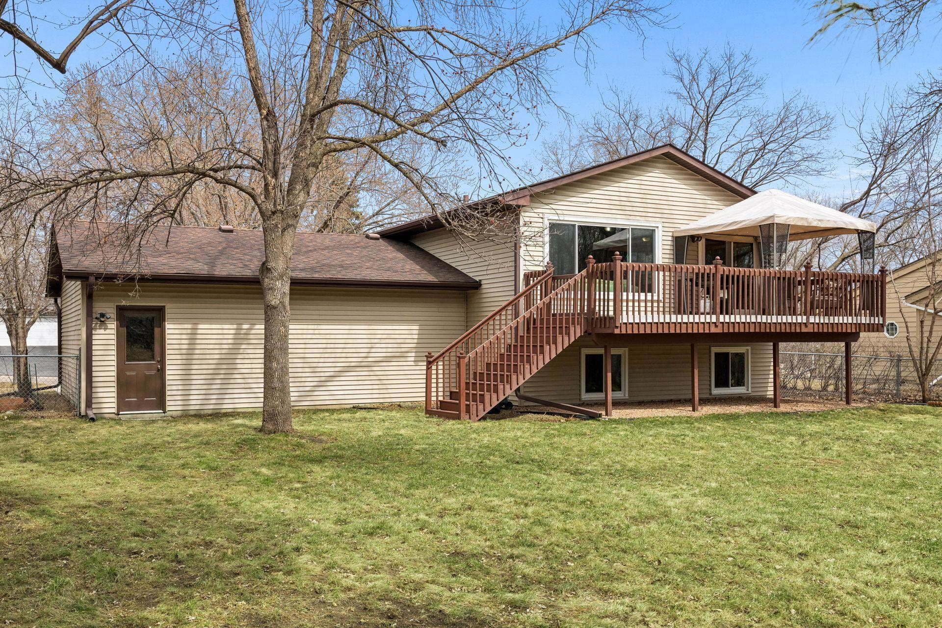 Maintenance free siding and large fenced backyard! The large deck & canopy provide a private oasis that backs up to Sunrise Park!