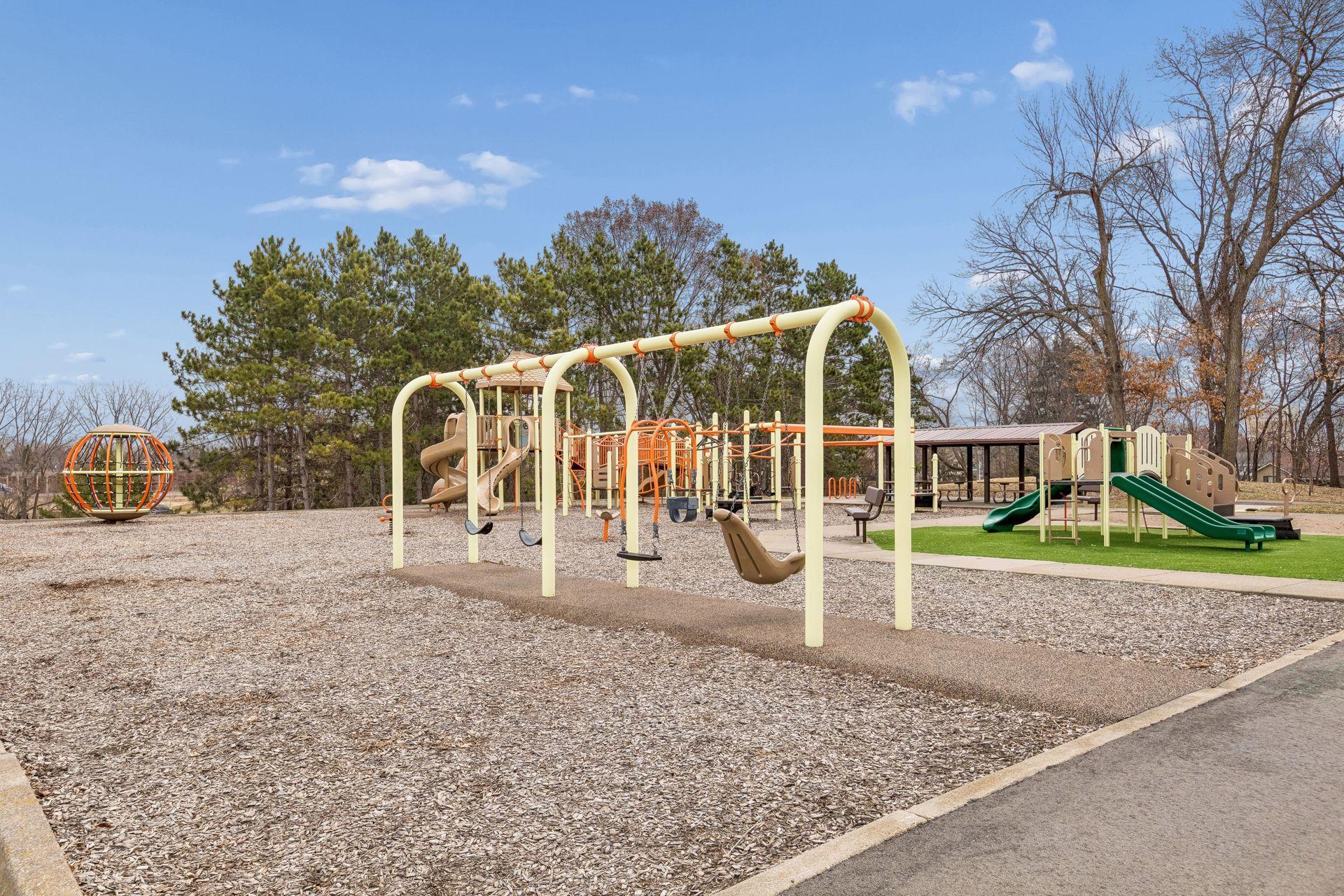 Enjoy the playground at the park, right out your back door.
