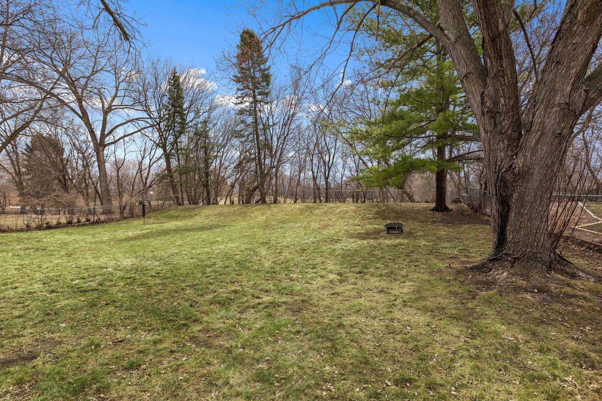 Another view of the private backyard with chain link fencing that abuts park & walking path.
