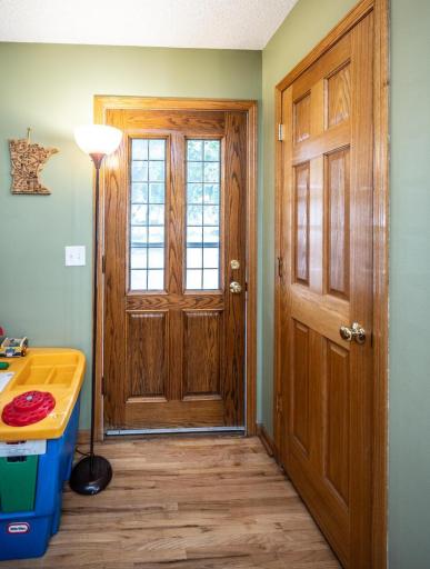 Front door with a storage closet nearby