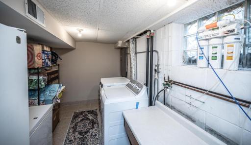 Washer and dryer are newer, and there is room for storage in the laundry room.
