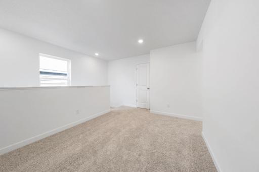 (Photo of a very similar home, actual finishes may vary)