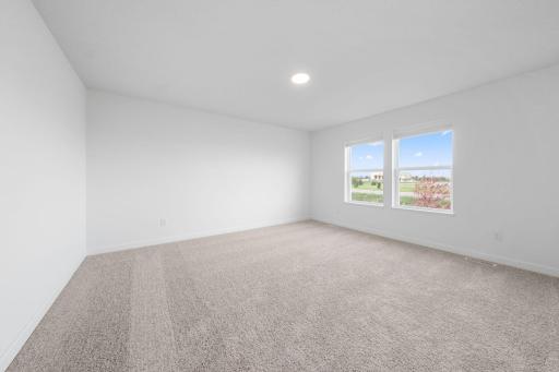 (Photo of a very similar home, actual finishes may vary)