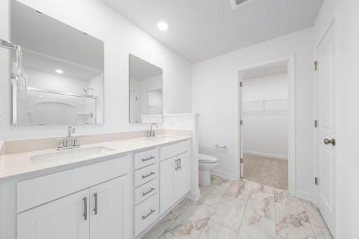 (Photo of a very similar home, actual finishes may vary)
