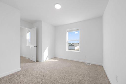 (Photo of a very similar home, actual finishes may vary)