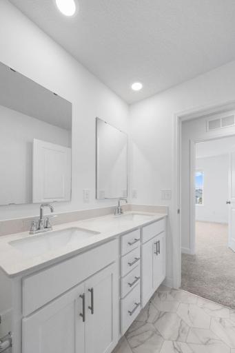 (Photo of a very similar home, actual finishes may vary)