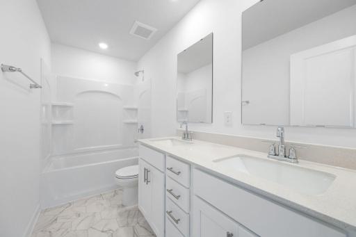 (Photo of a very similar home, actual finishes may vary)