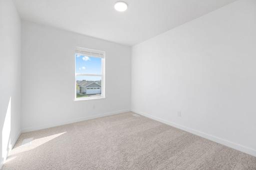 (Photo of a very similar home, actual finishes may vary)