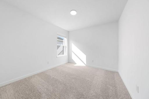 (Photo of a very similar home, actual finishes may vary)