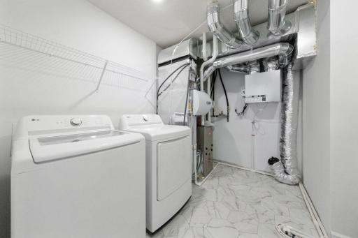 (Photo of a very similar home, actual finishes may vary)