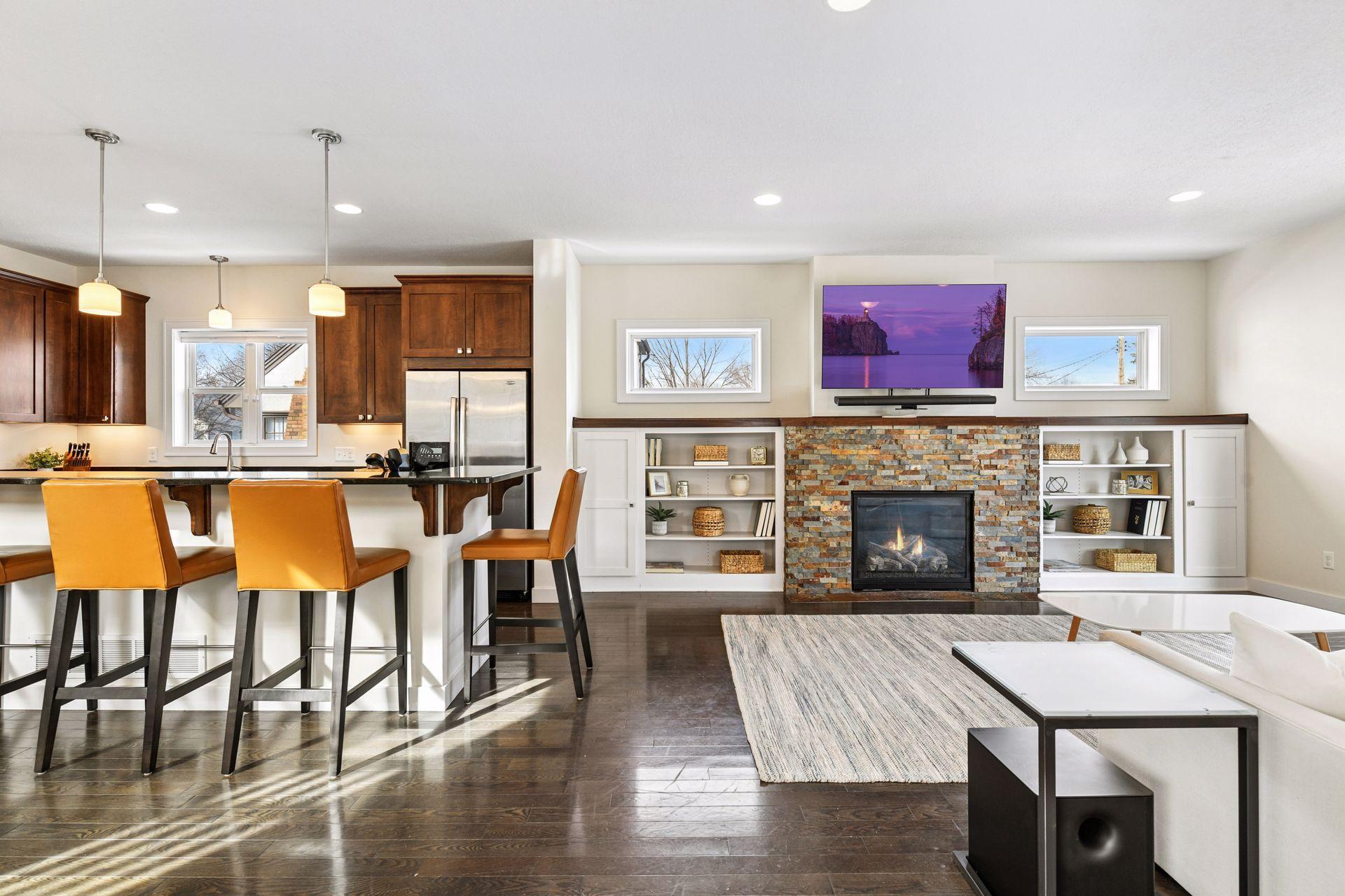 Handsome stone gas fireplace and built-in book shelves