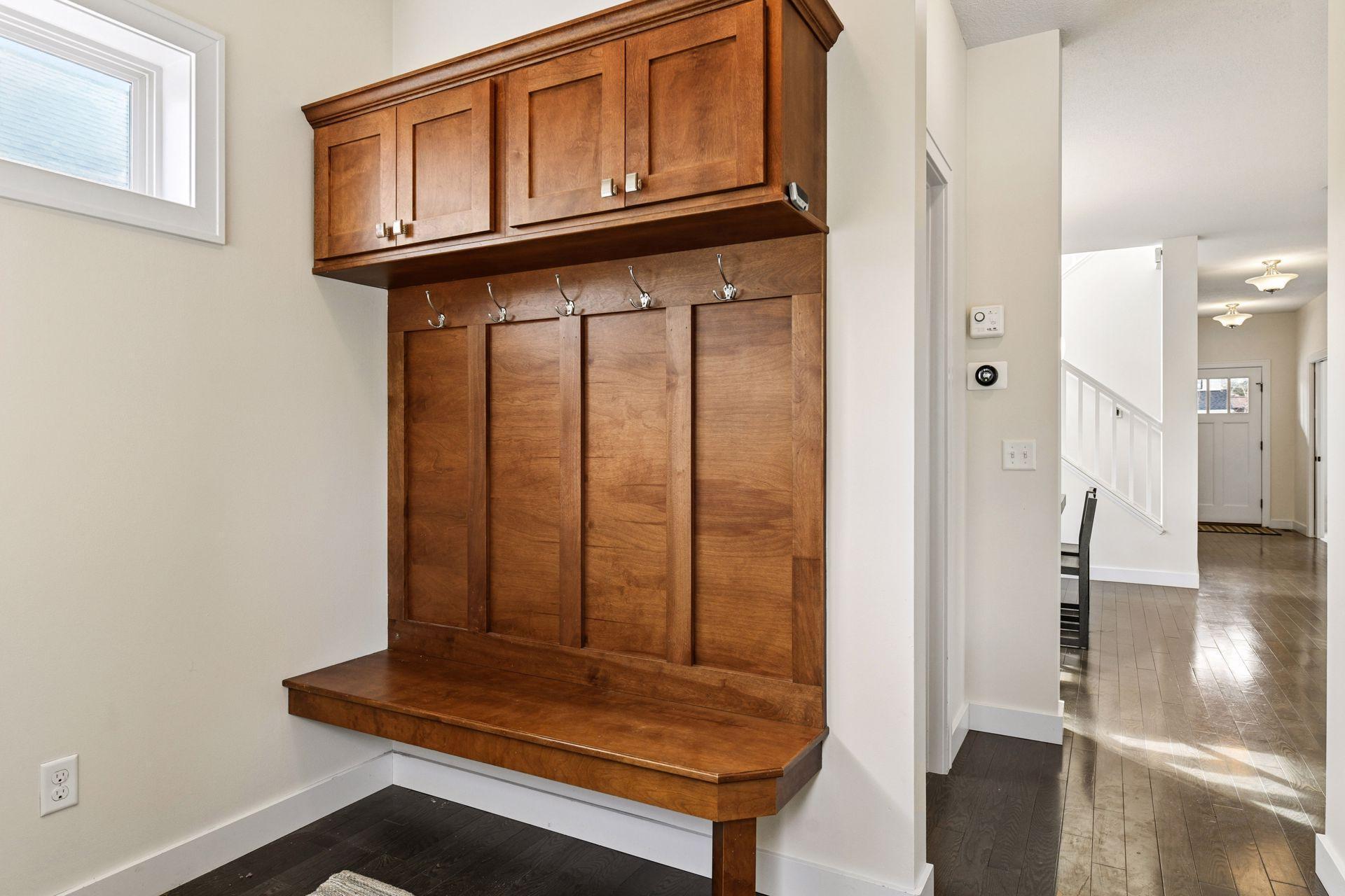 Back mudroom with bench seat, storage and large closet