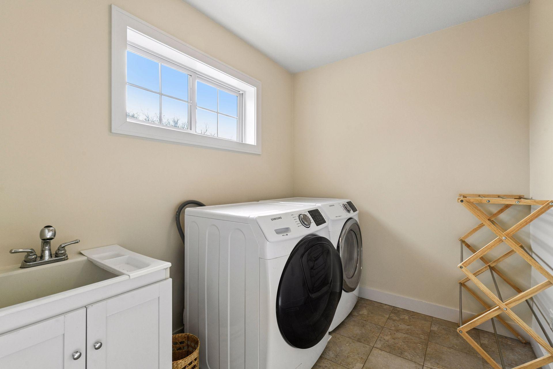 The laundry room is conveniently located on the upper level