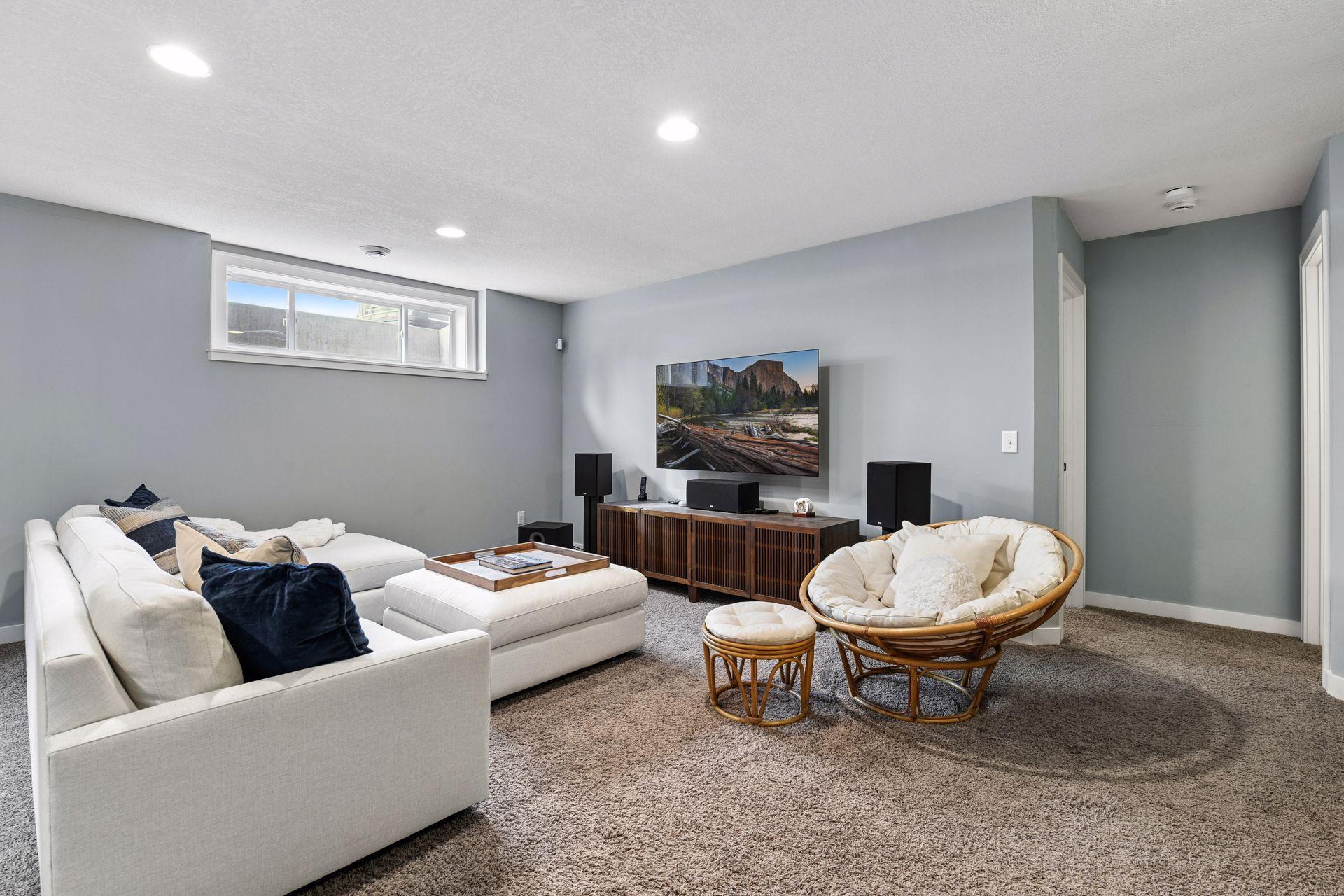 Spacious lower level family room - perfect for entertaining. The tall ceilings make the room feel so inviting and comfortable