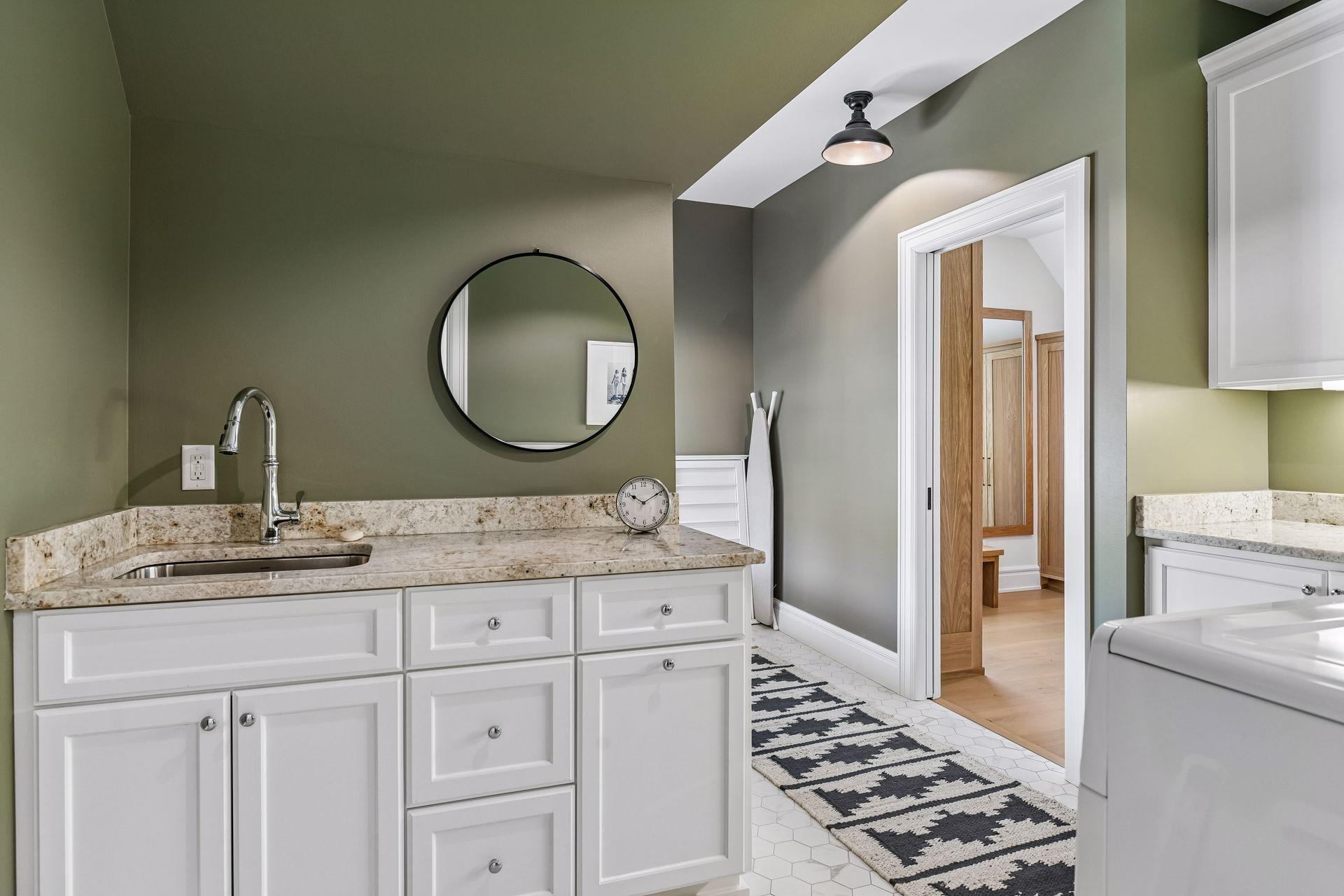 Laundry room with acess to primary closet