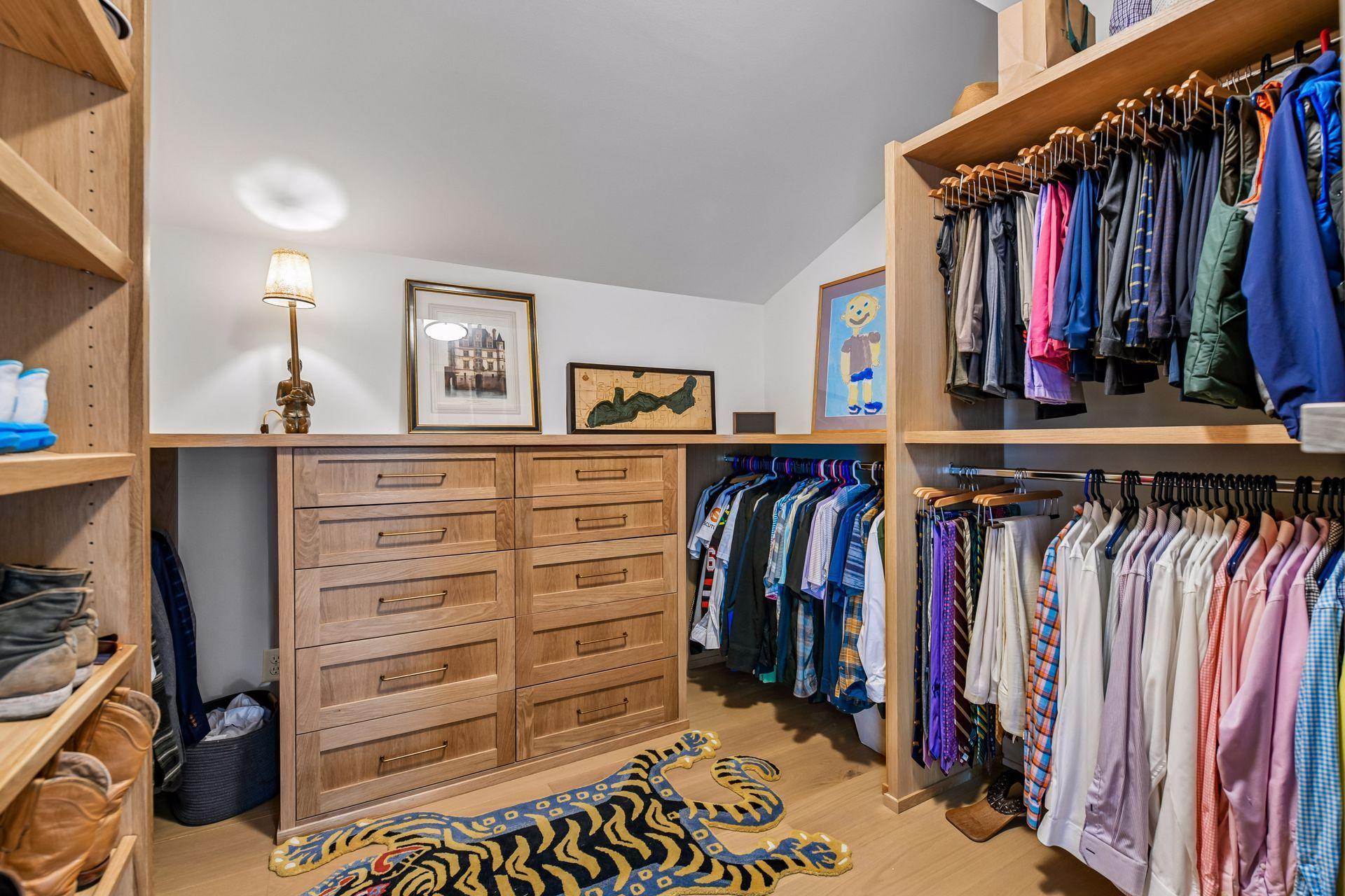 Brand new double primary closets with solid white oak built-ins