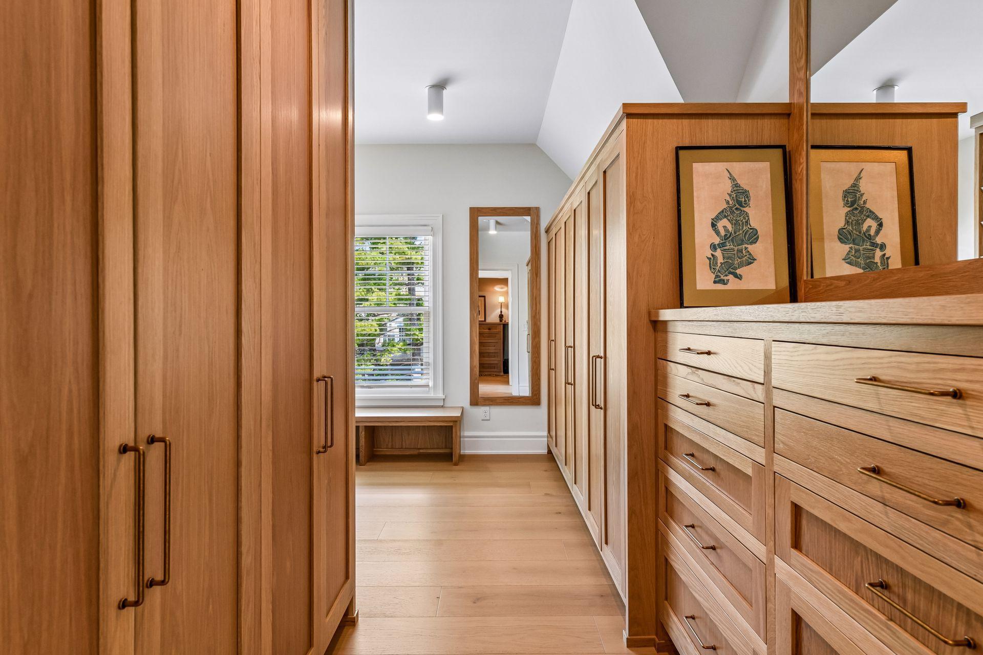 Brand new double primary closets with solid white oak built-ins