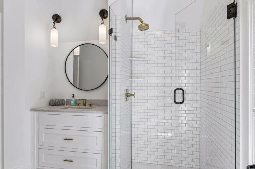 Bathroom attached to bedroom 3 with acess to hallway. Floor newly tiled