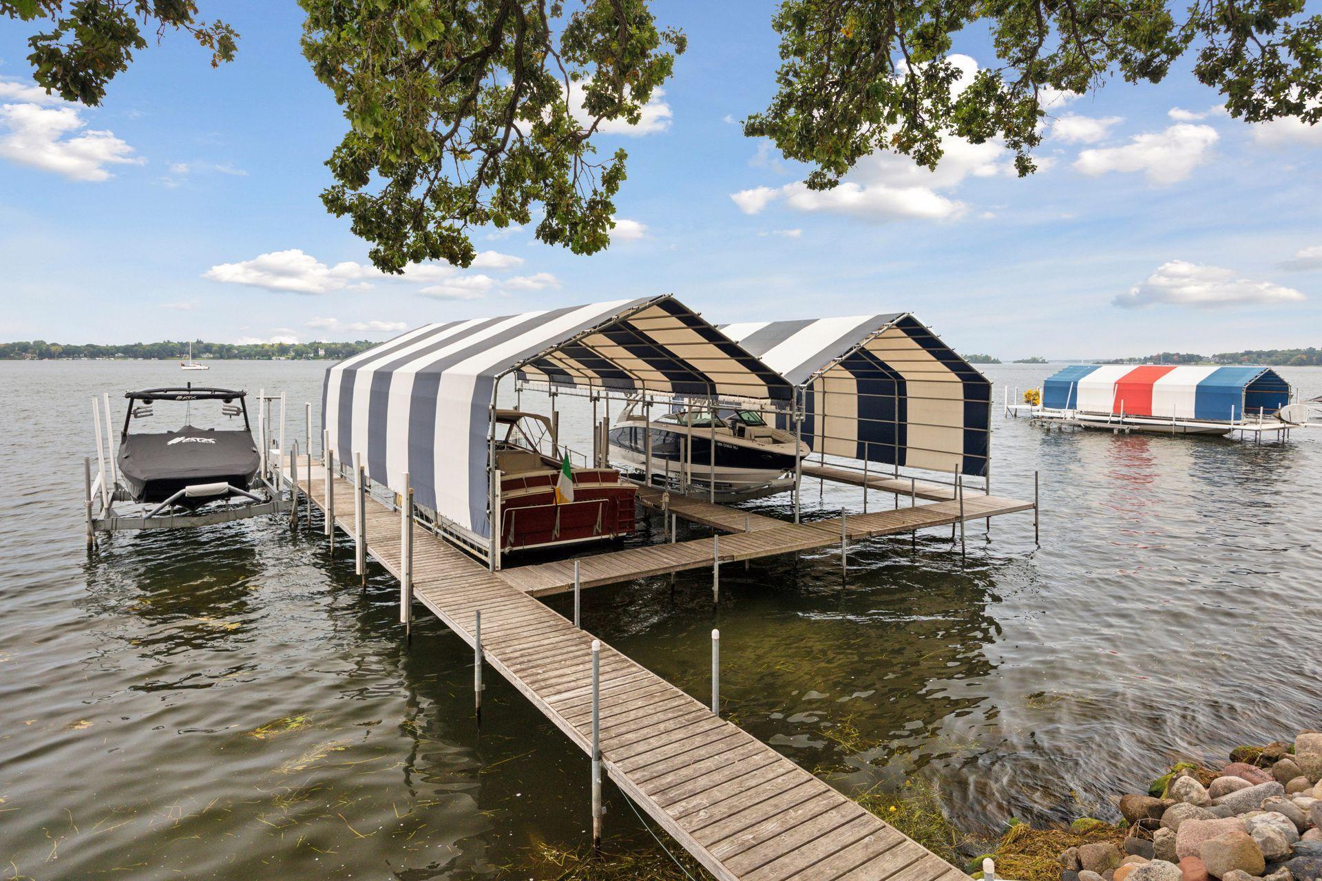 Dock with double slip and covered canopy. Lift is not included.