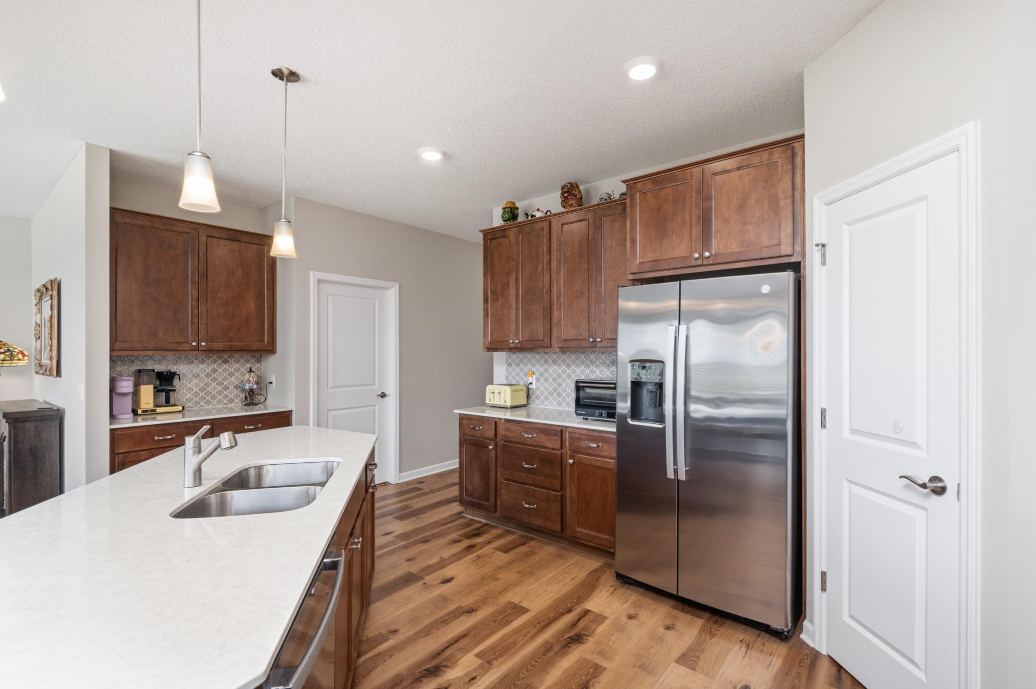 Another view of the Kitchen with pantry and coffee station