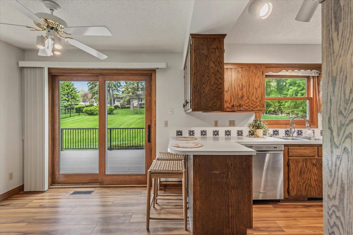 Sliding door to the maintenance free deck and gorgeous backyard