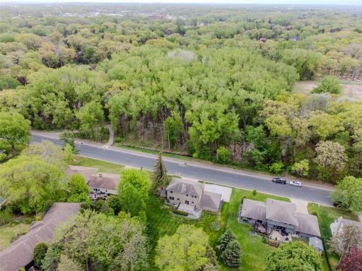 Nestled in a treelined neighborhood across from wooded walking trails and near Dodge Nature Center