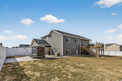 Large backyard with patio under deck and on the side