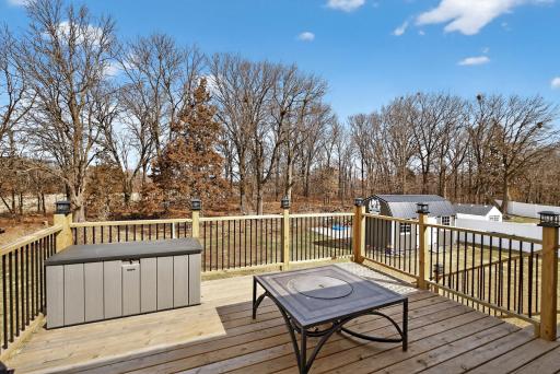 View from large deck to wooded area behind