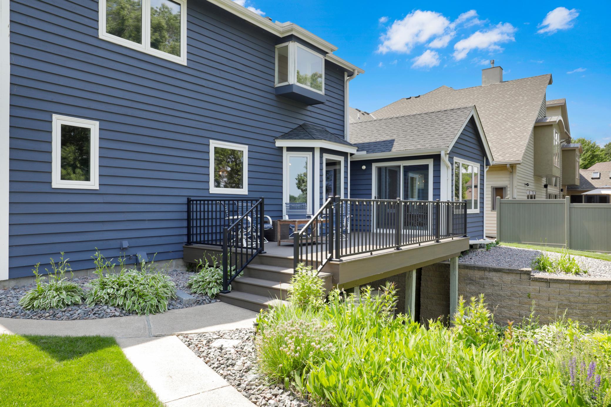 The maintenance free deck features an underdeck roofing system to divert water away from the home and provide a covered patio space below.