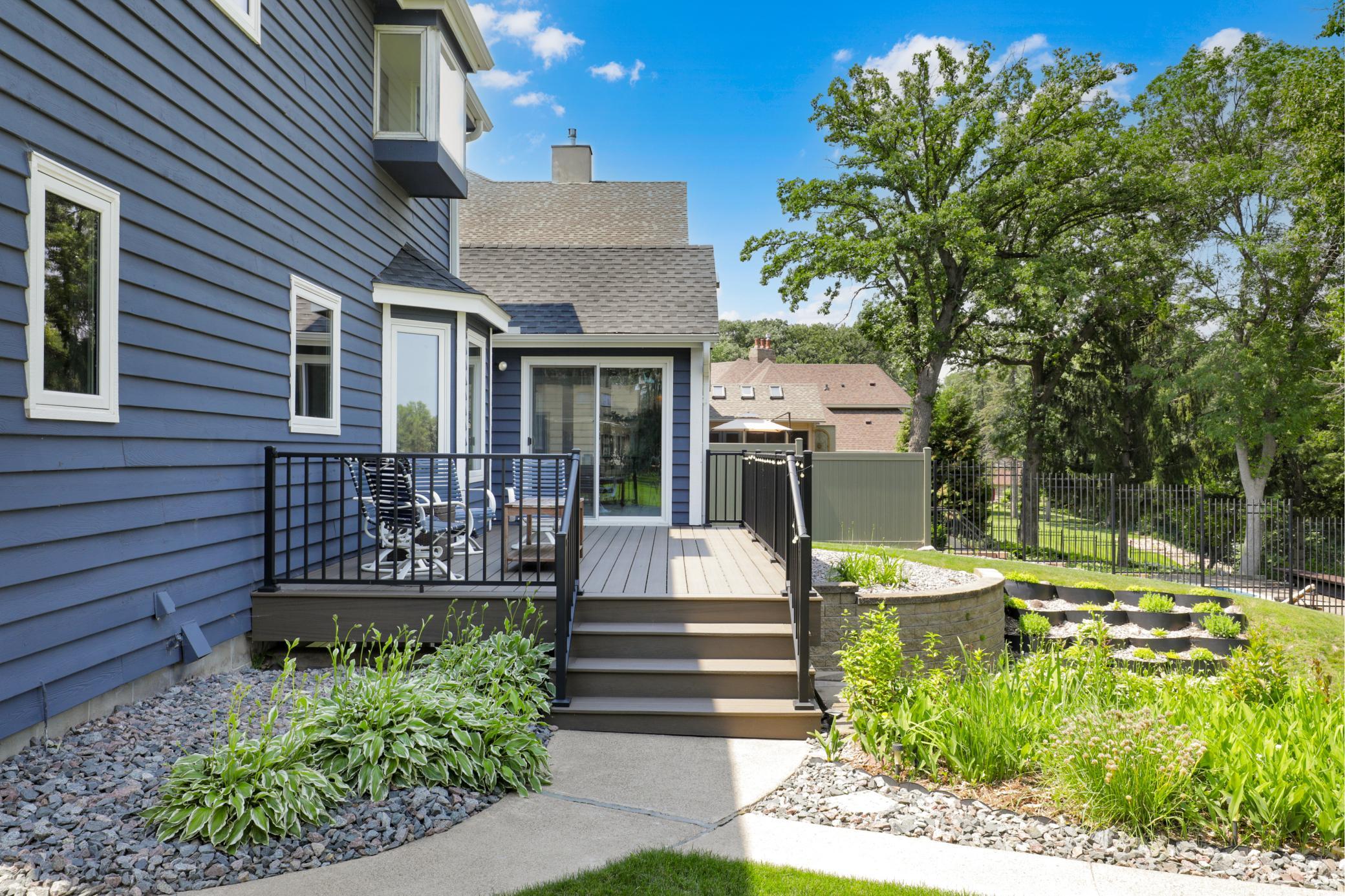 The maintenance free deck features an underdeck roofing system to divert water away from the home and provide a covered patio space below.