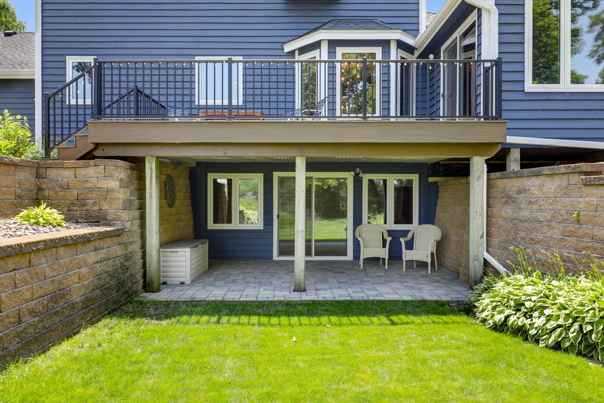 A covered paver patio is located just through the sliding glass door which is great for watching storms roll in over the river bluff.