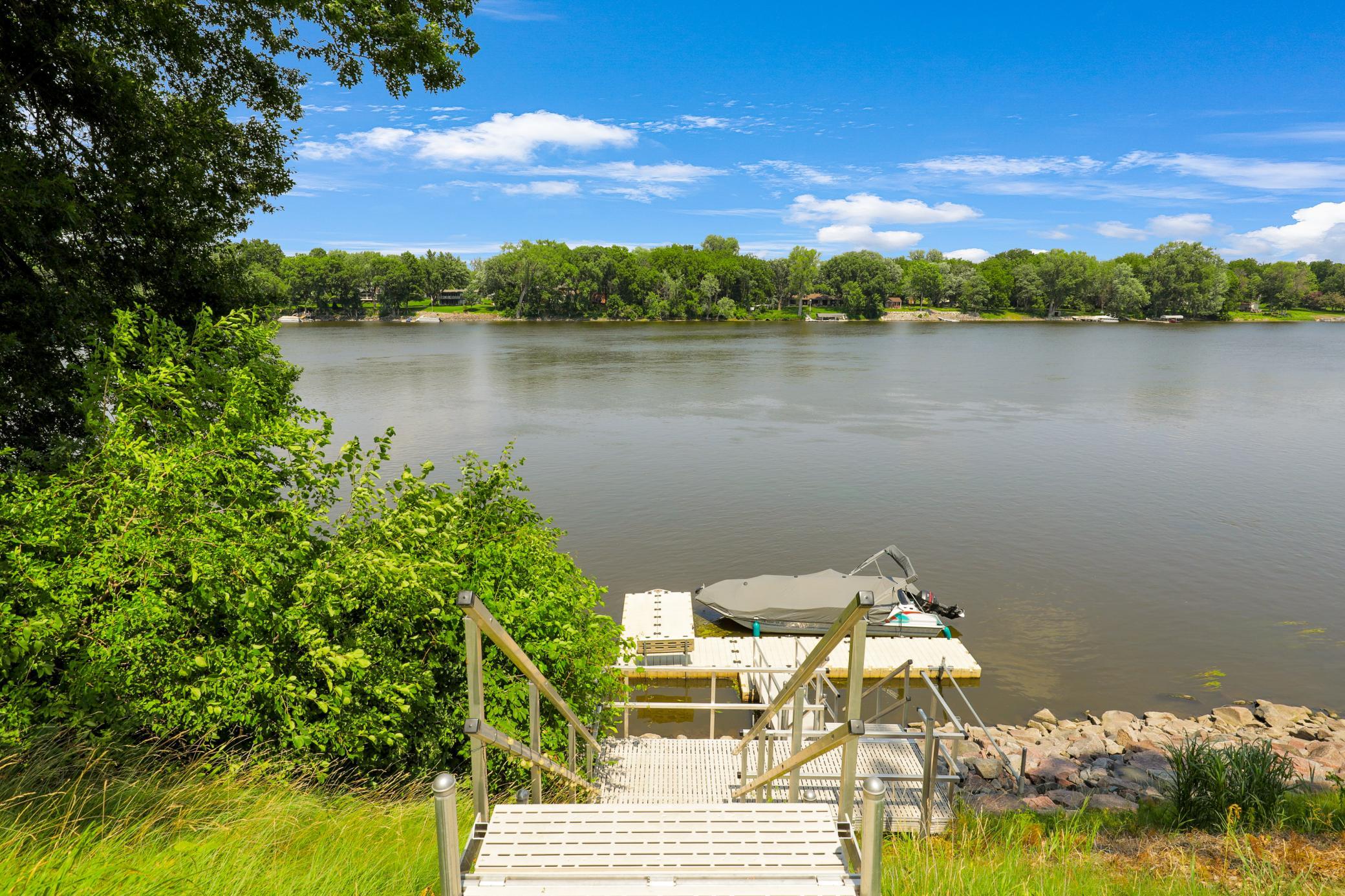 A maintenance free, aluminum-constructed stairway leads down to a maintenance free, boat ready, floating dock system on the river, all built in 2020.