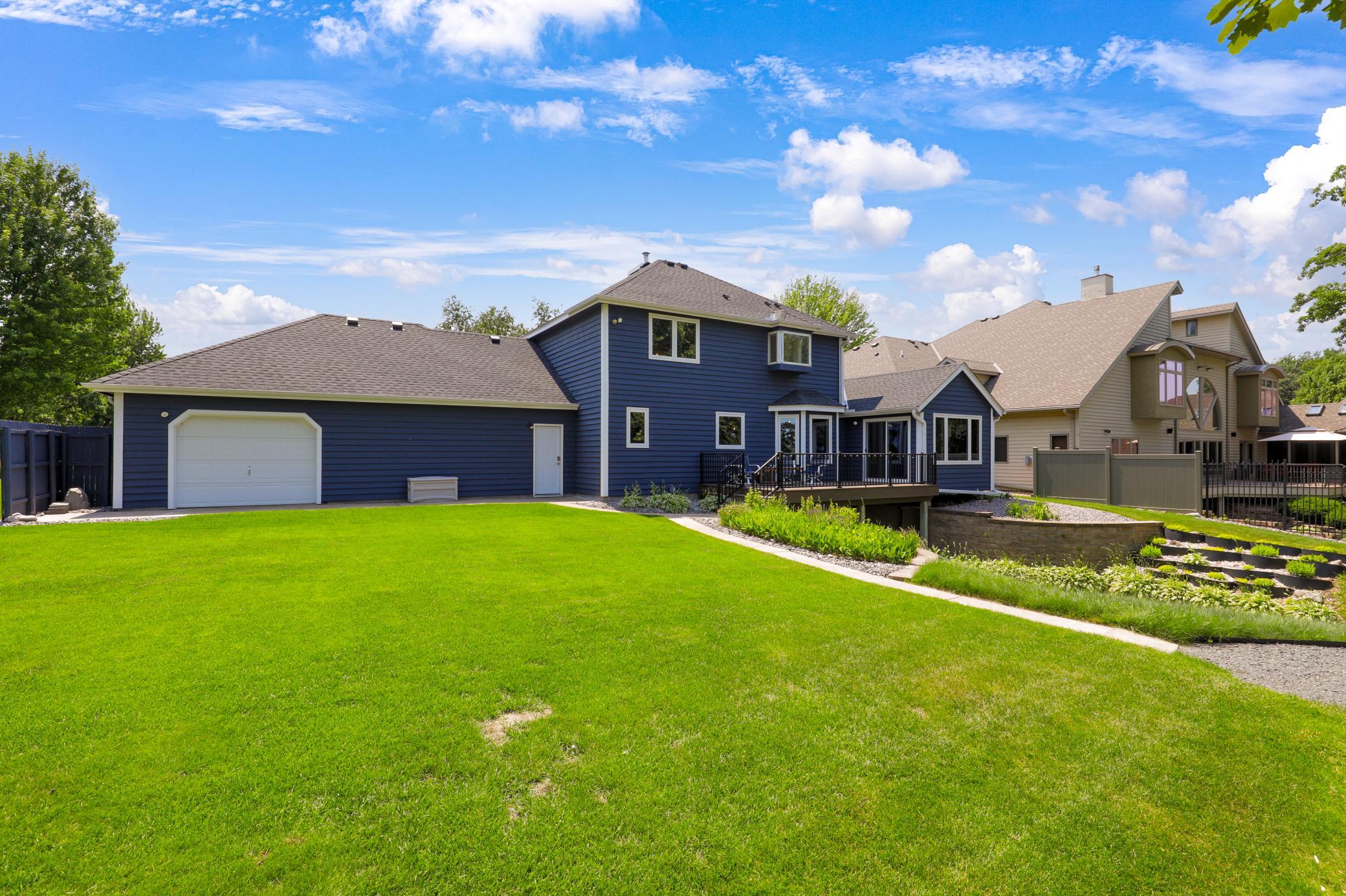 A rear garage door from the garage’s 3rd stall provides easy access to the backyard. The 3-stall garage is wired with 240 amp service which will facilitate an EV charger.