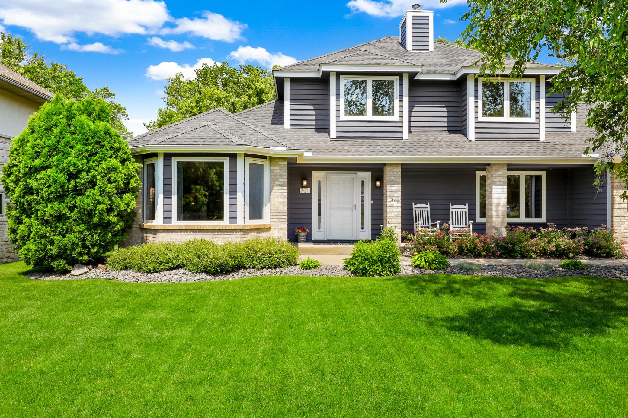 The first floor features a bright floorplan with the kitchen open to the dining and living rooms.