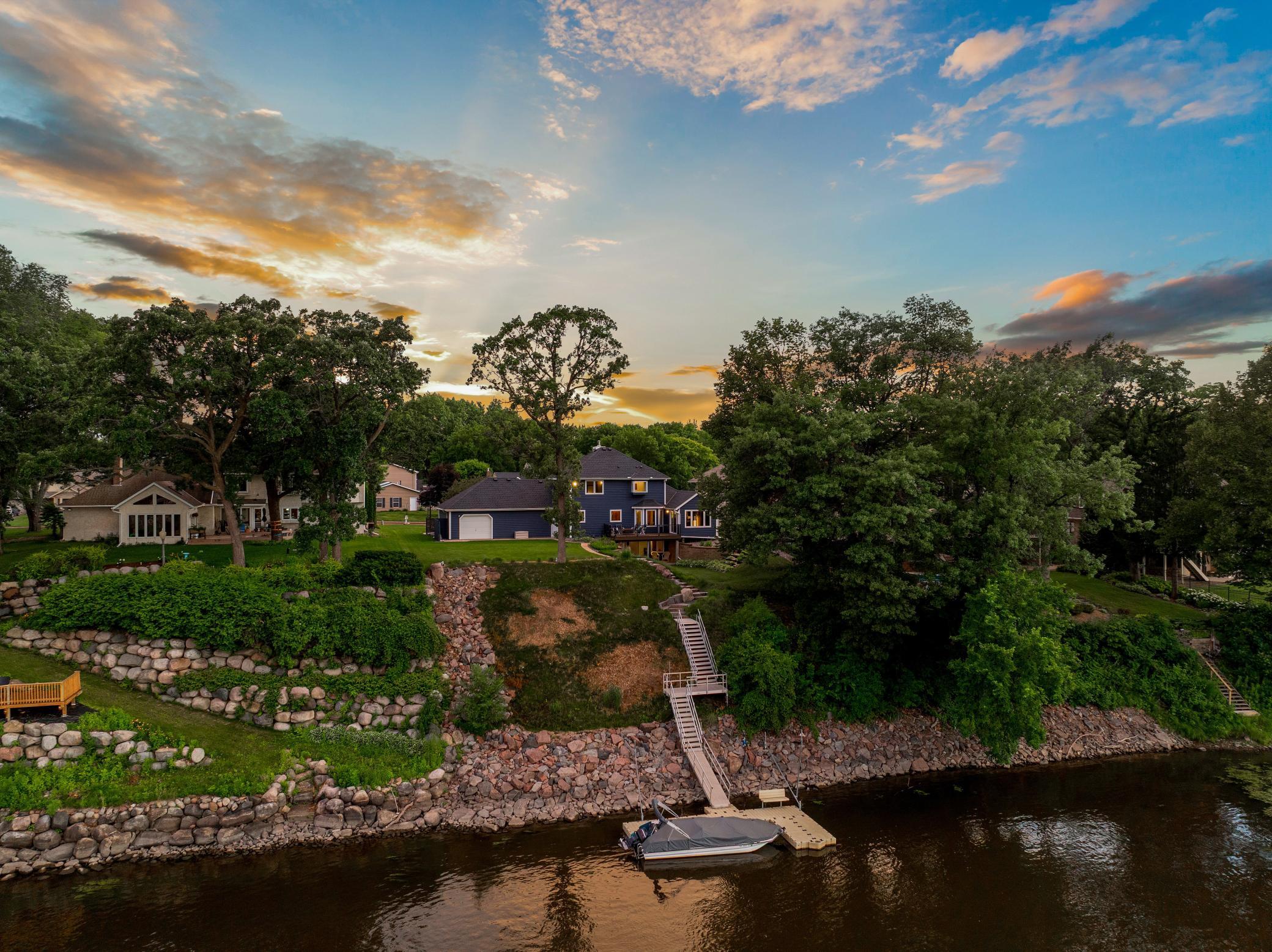 The 97 feet of Mississippi River shoreline has been significantly upgraded by the current owners with granite rip rap, erosion resistant fescue grass, landscaping, poured footings for dynamic anchoring/winching, and custom granite stairs.