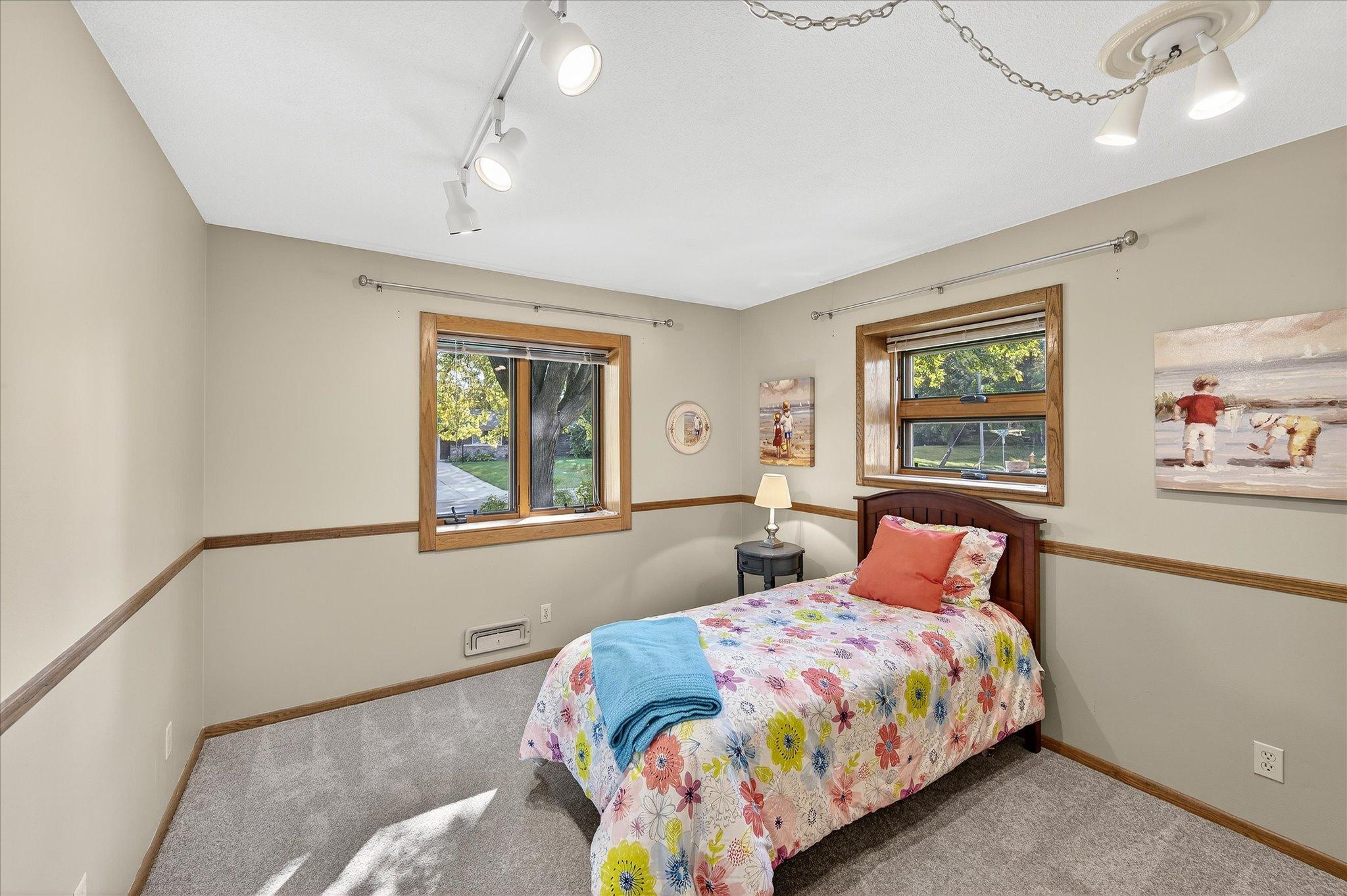 Bedroom 2. New carpet and updated windows. Plenty of light. Recently replaced lighting, not pictured.