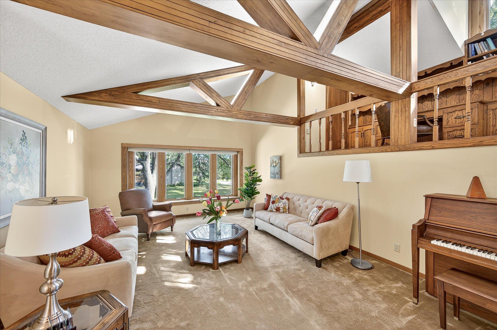 Vaulted ceilings with lights in the beams give a warmth to this dynamic room.