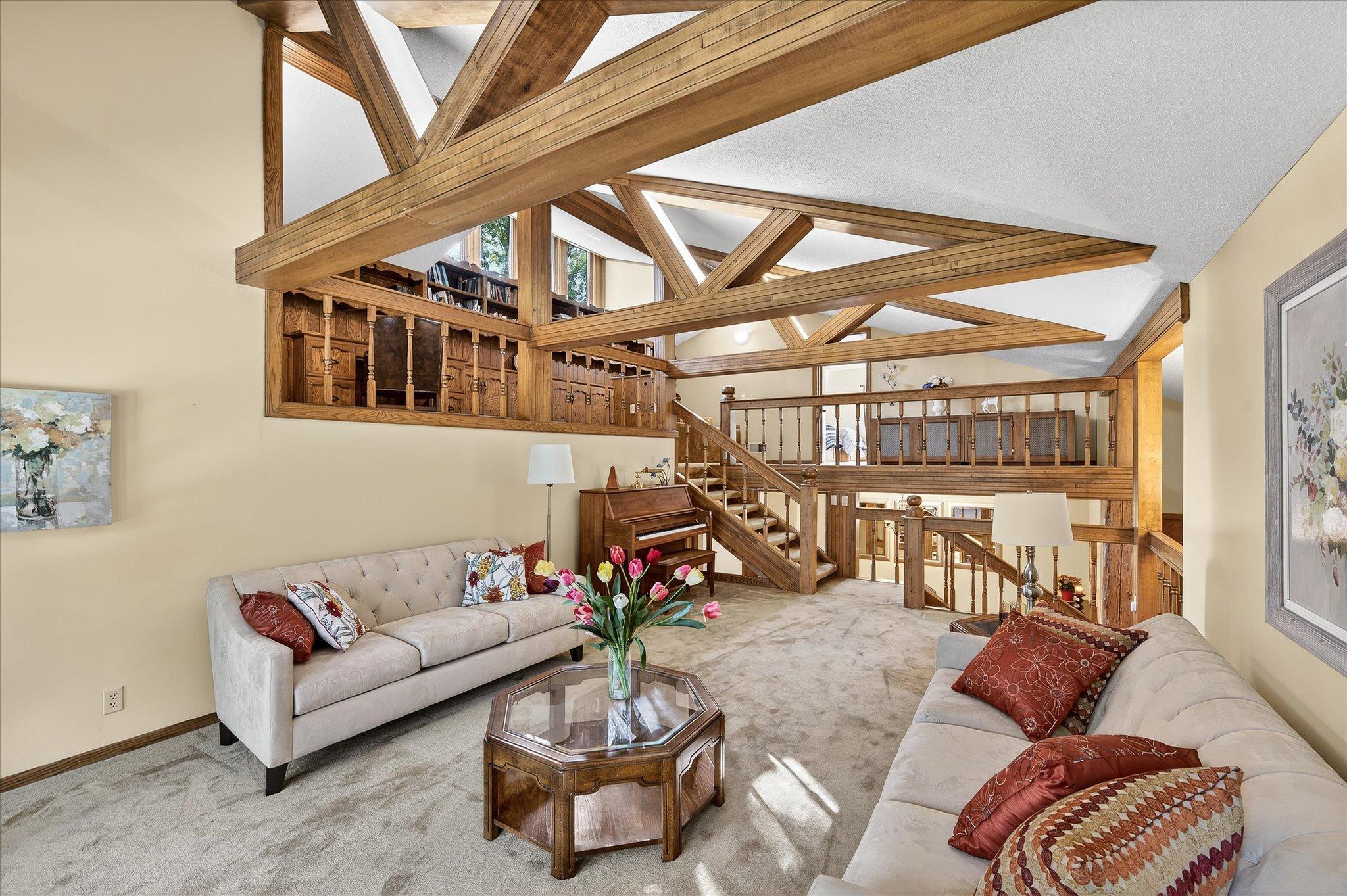 Great room for entertaining! Balconies on each side help showcase the woodwork.