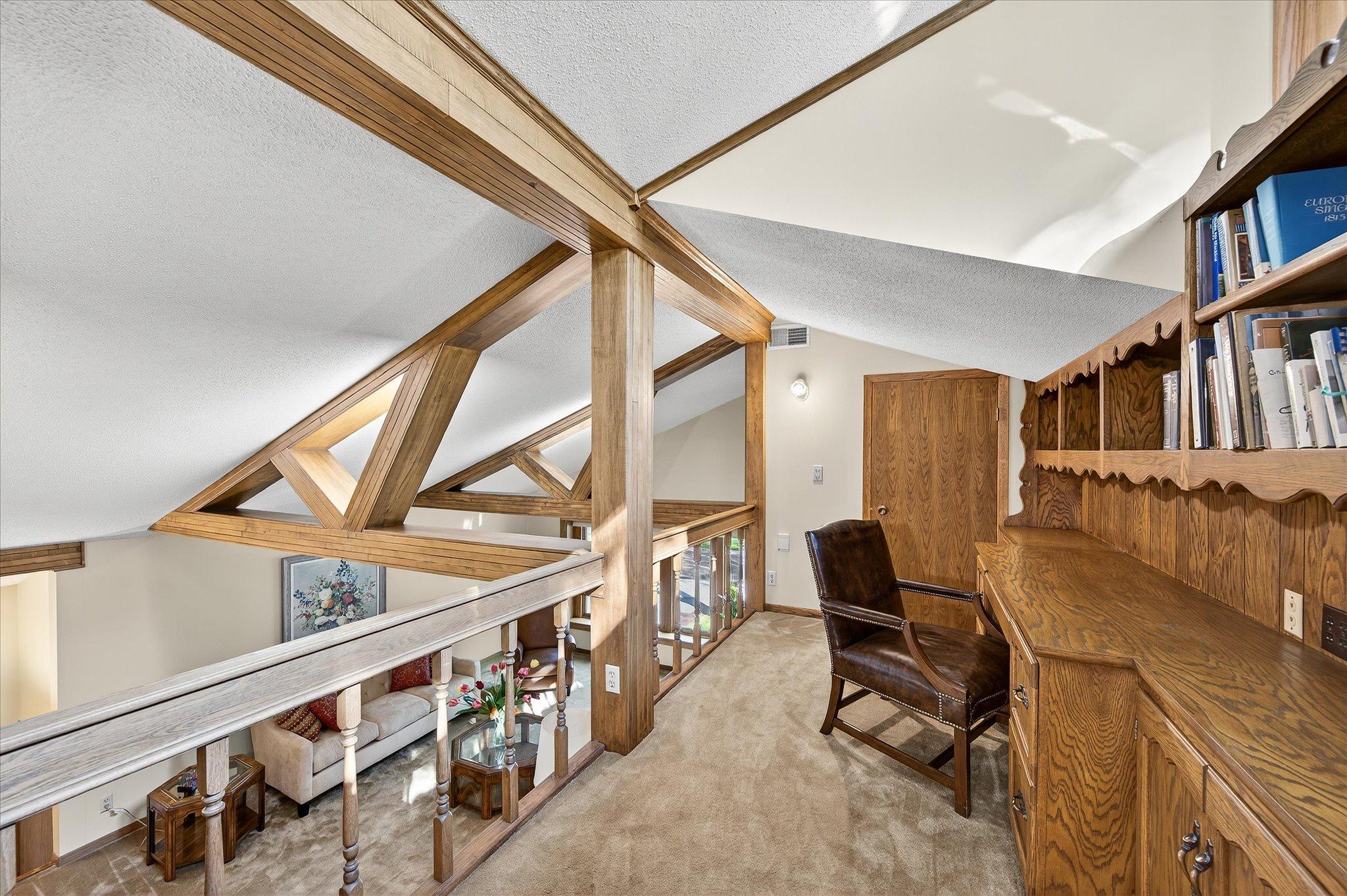 Office and library area with walk in storage closet behind the door.