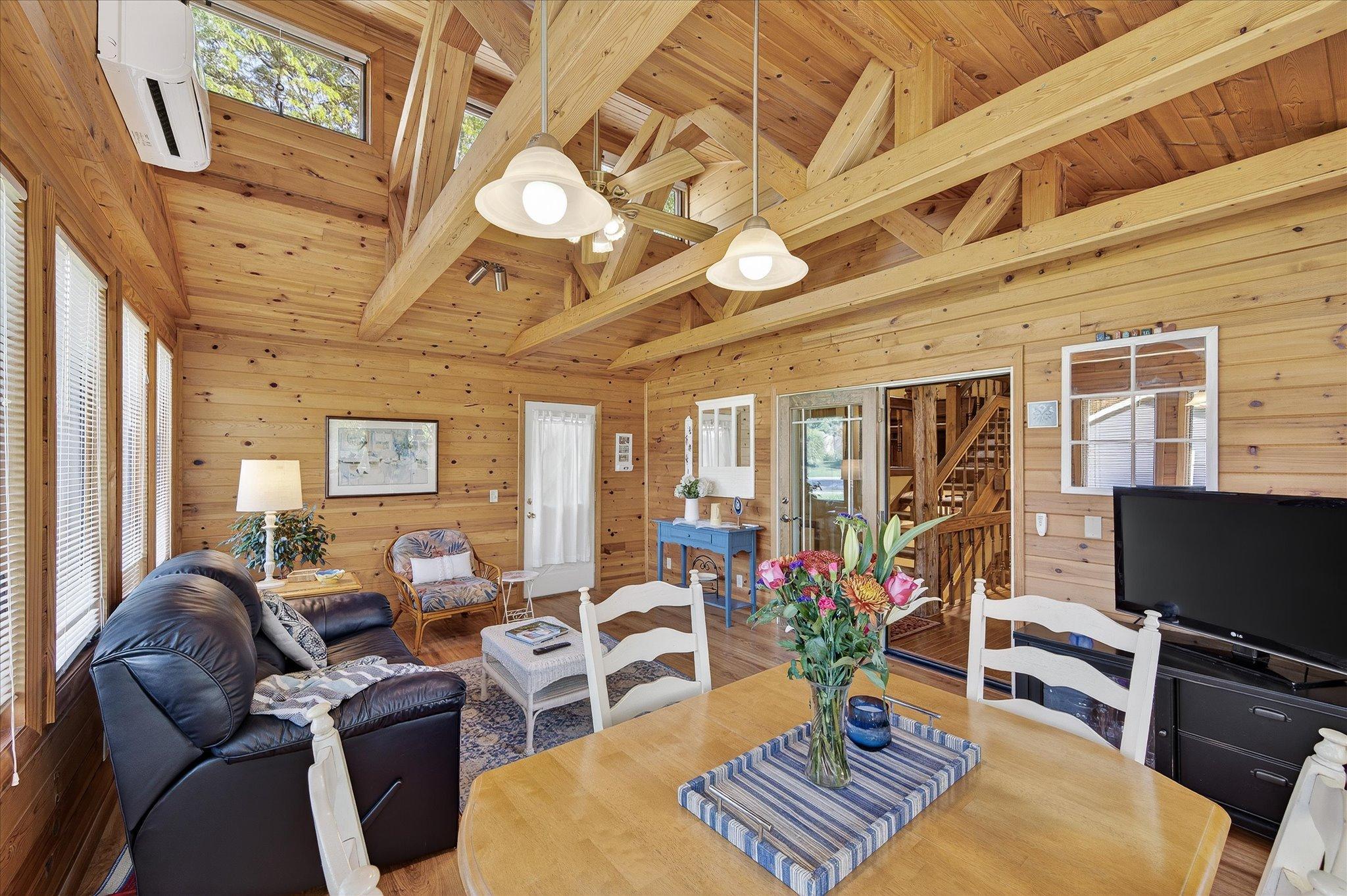 One door goes to the outside patio, one to the back of the garage and one French door to the main house.
