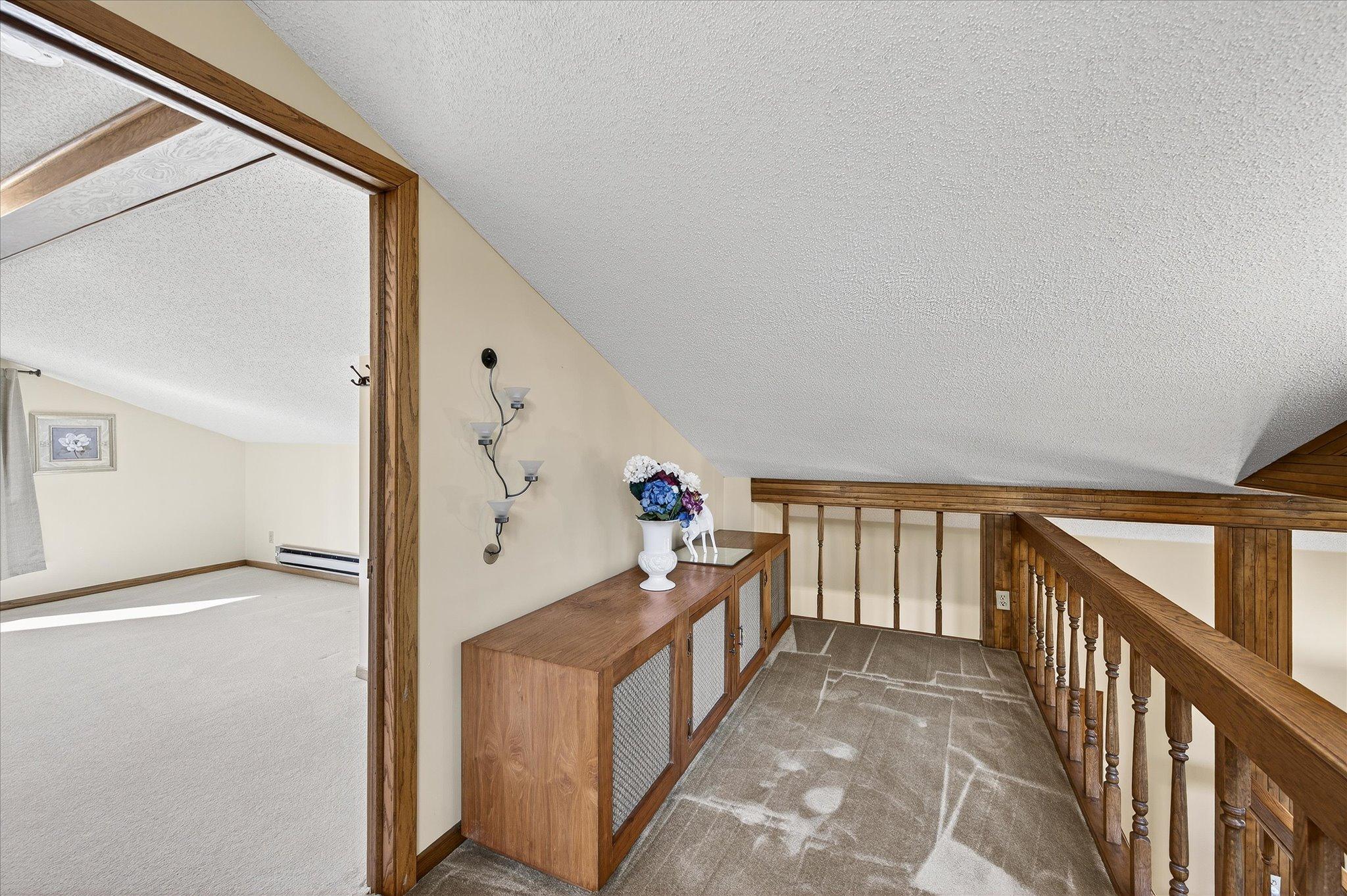 Balcony overlooks living room and off of 4th bedroom. This has a sloped ceiling.